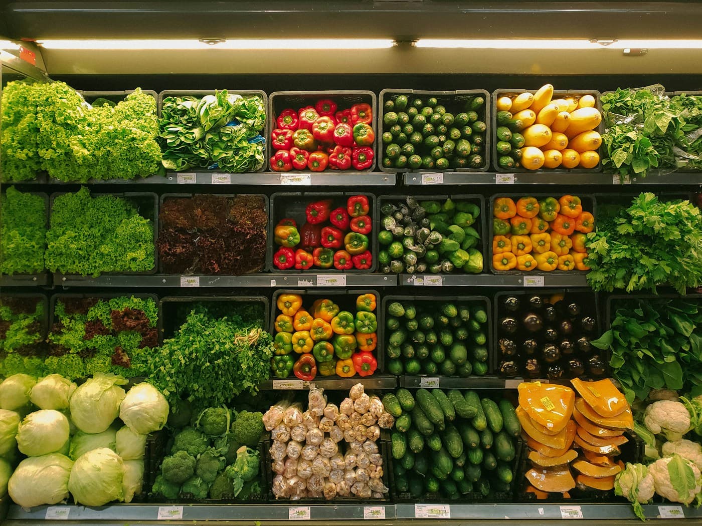 Fresh vegetables arranged in a neighbourhood grocery shop